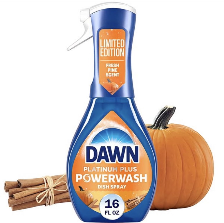 A bottle of Dawn Platinum Plus Powerwash Dish Spray pictured in front of cinnamon and a pumpkin.